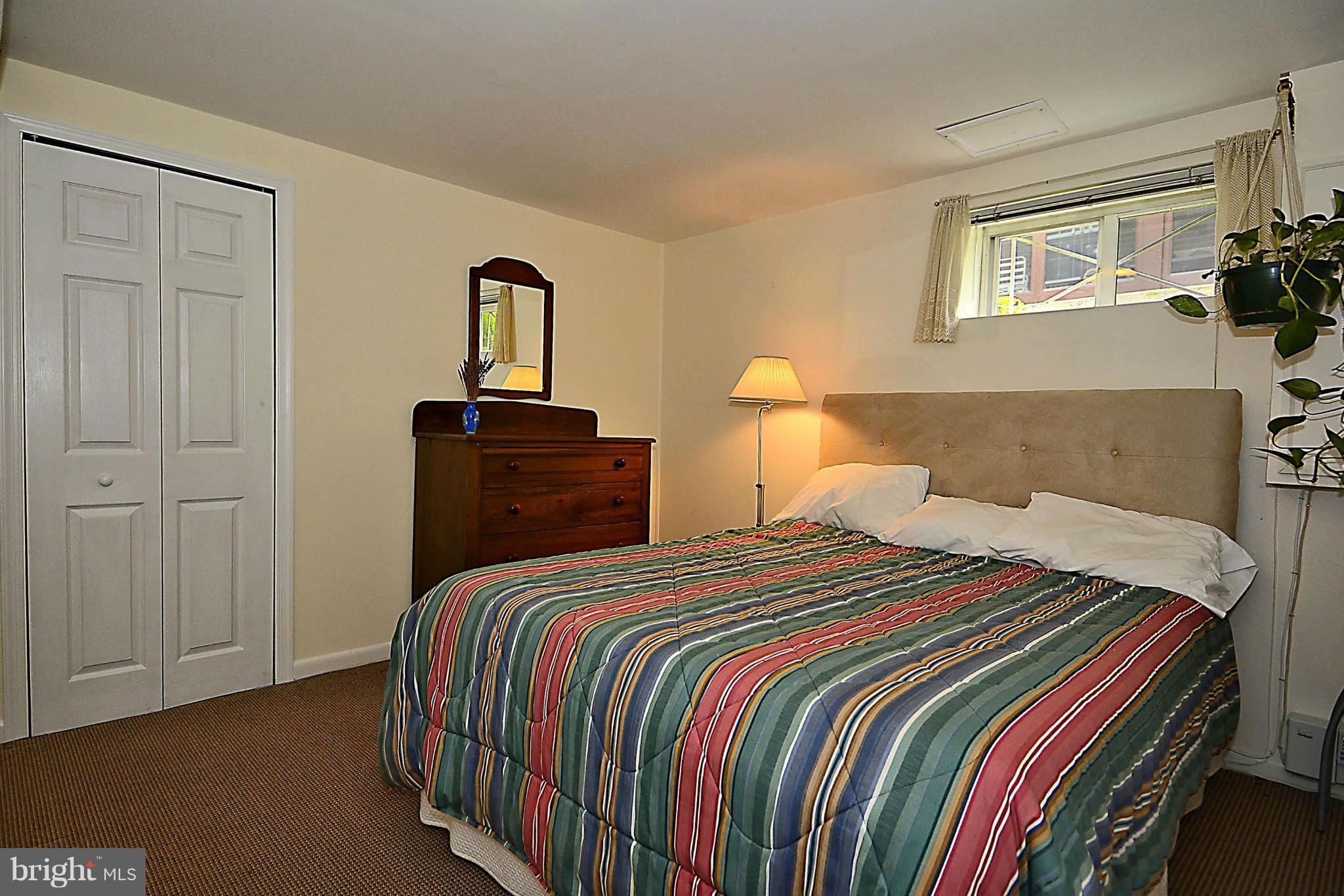 510 Ashford Road Silver Spring, MD 20910 - Photo 16 of 30 a bedroom with a bed and two dresser