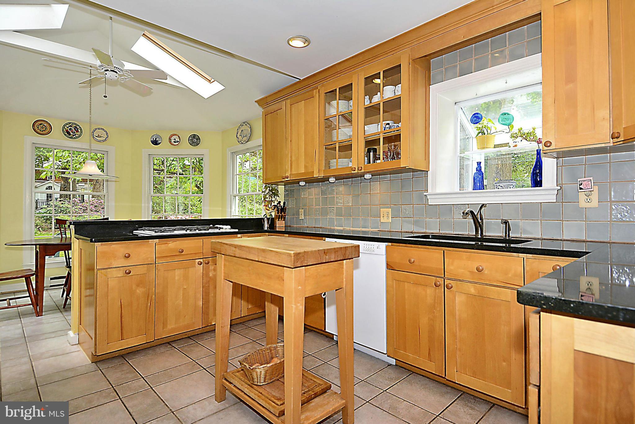 510 Ashford Road Silver Spring, MD 20910 - Photo 5 of 30 a kitchen with stainless steel appliances granite countertop a sink and a stove