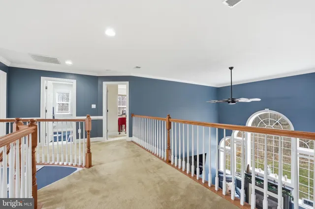a view of a livingroom with workspace and a window