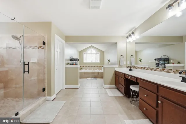 a bathroom with a bathtub and a window