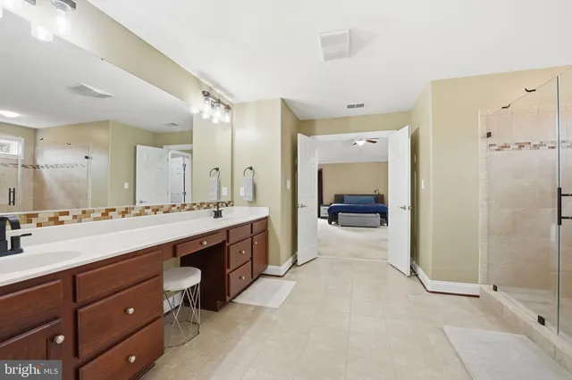 a bathroom with a glass shower door