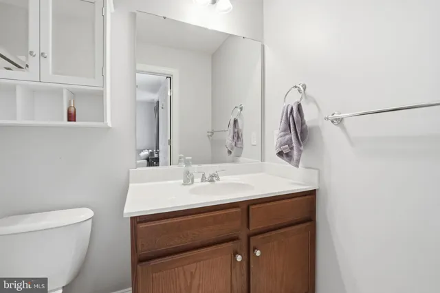 a room with gym equipment and a large mirror