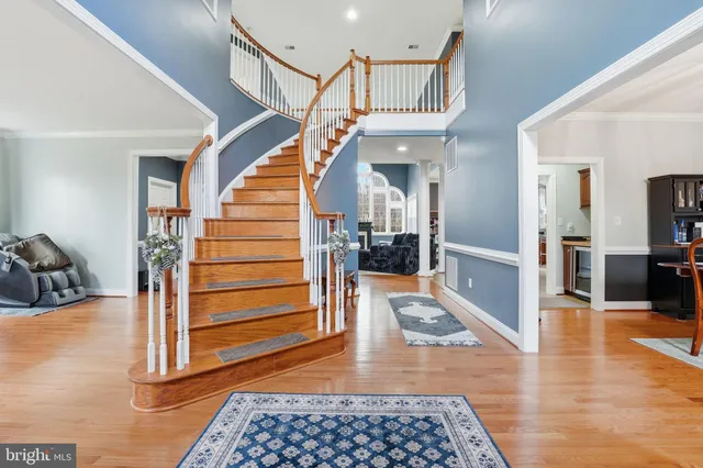 a view of an entryway with wooden floor