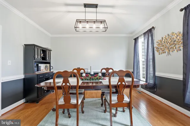 a view of a livingroom with furniture and a flat screen tv