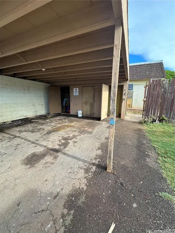 a view of a house with backyard and trees