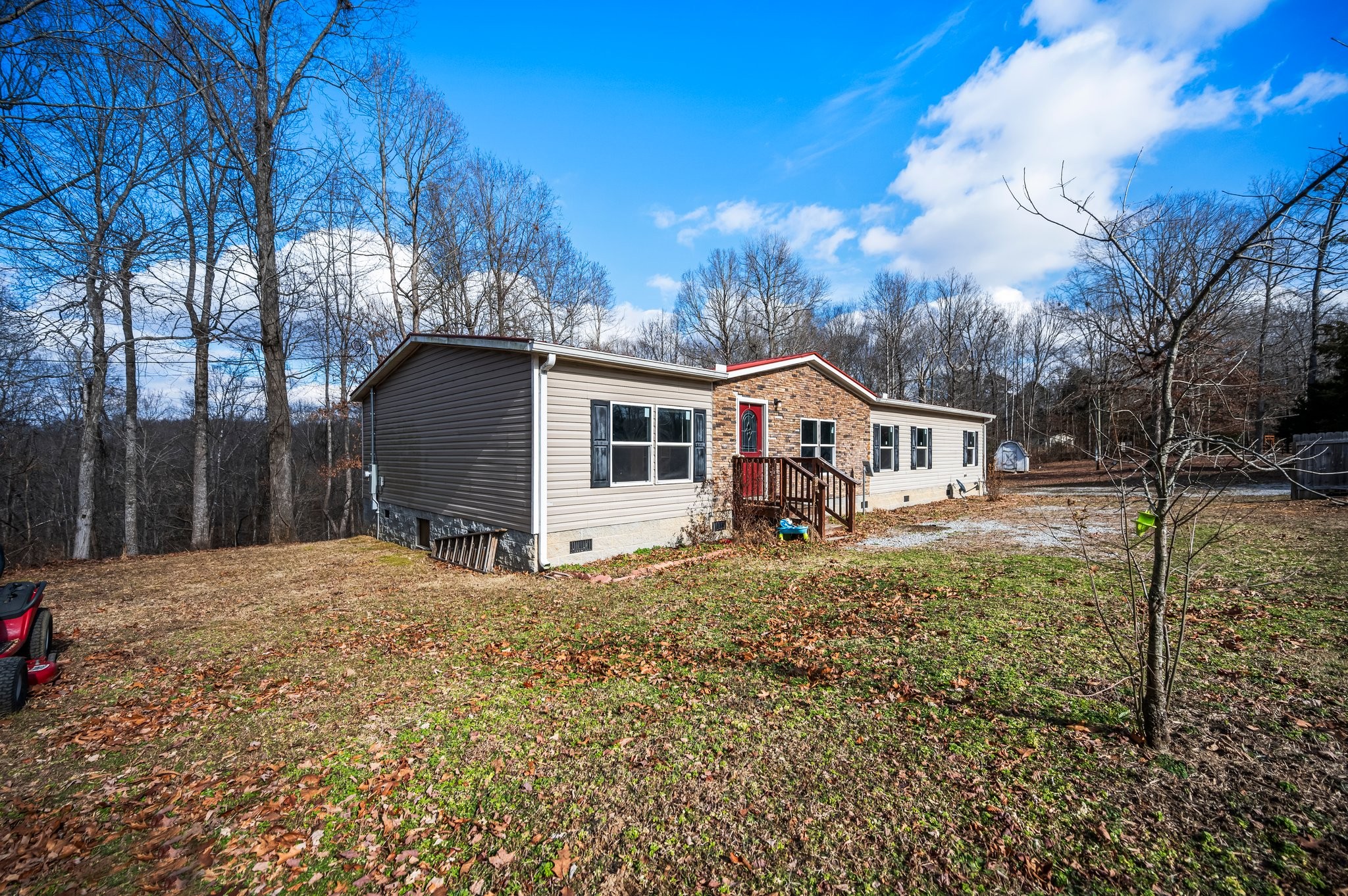 6684 Wesley Ridge Road Lyles, TN 37098 - Photo 3 of 37 a view of a house with a yard