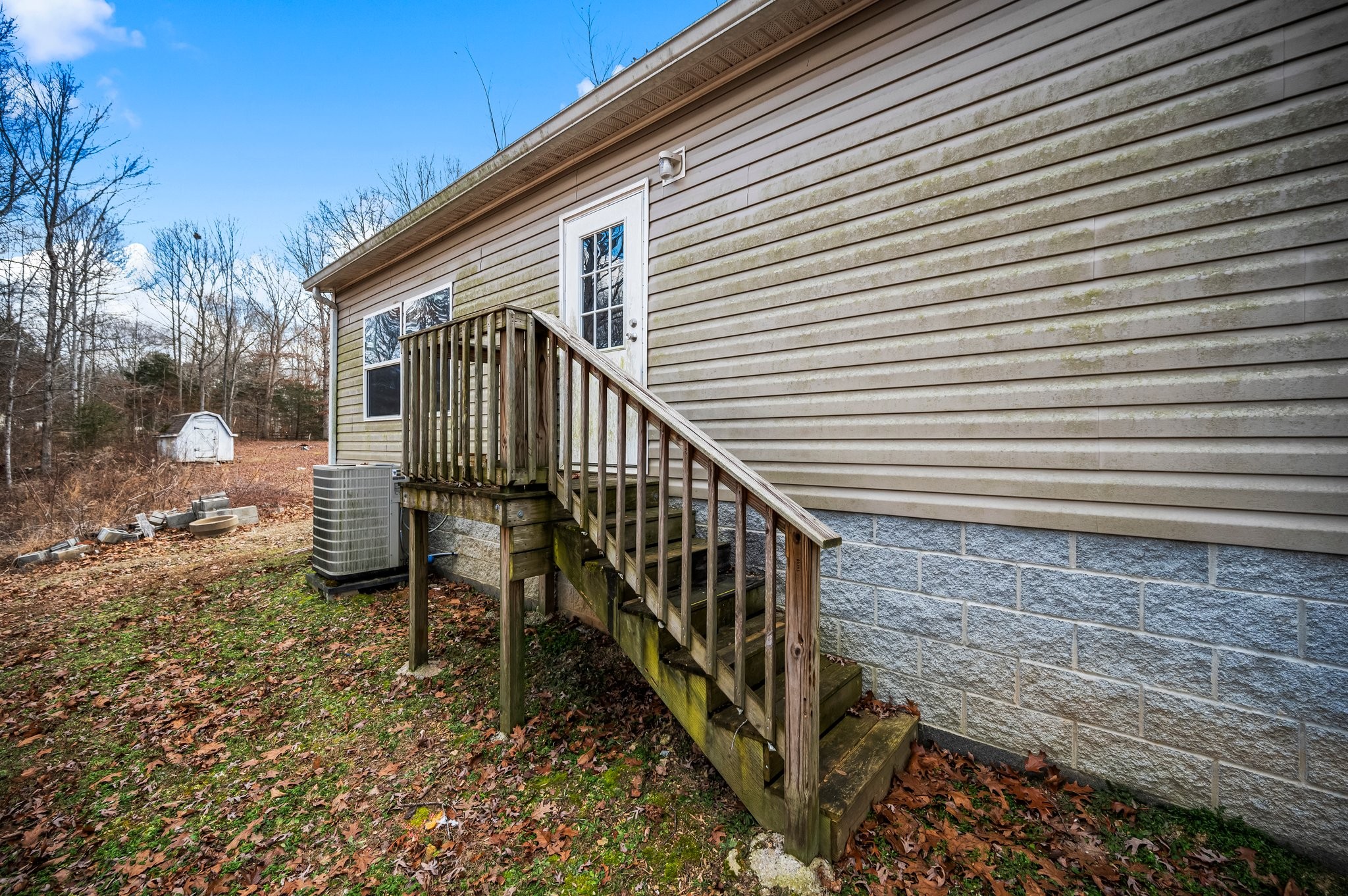 6684 Wesley Ridge Road Lyles, TN 37098 - Photo 35 of 37 a view of a house with backyard and deck