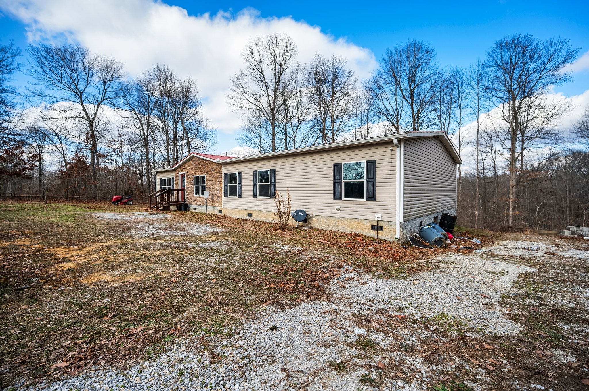 6684 Wesley Ridge Road Lyles, TN 37098 - Photo 4 of 37 a view of a house with backyard and trees