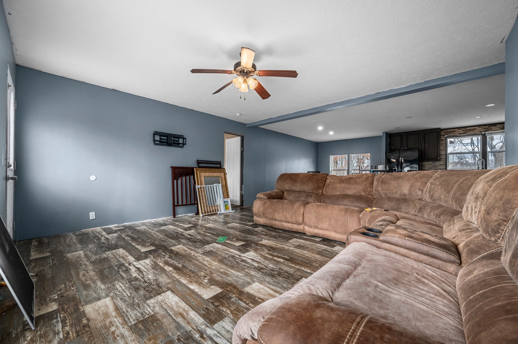 6684 Wesley Ridge Road Lyles, TN 37098 - Photo 8 of 37 a bedroom with a large bed and a chandelier