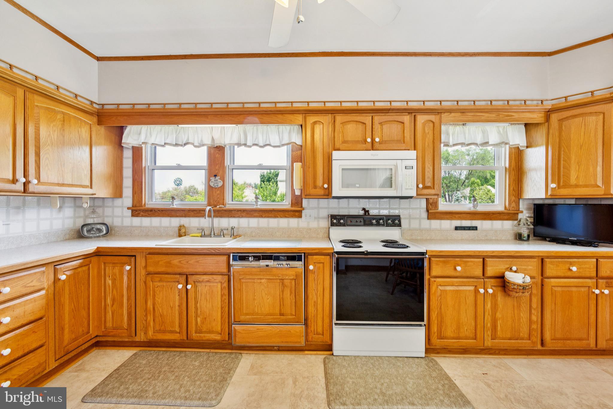615 Convent Road Aston, PA 19014 - Photo 14 of 39 a kitchen with a sink stove and cabinets