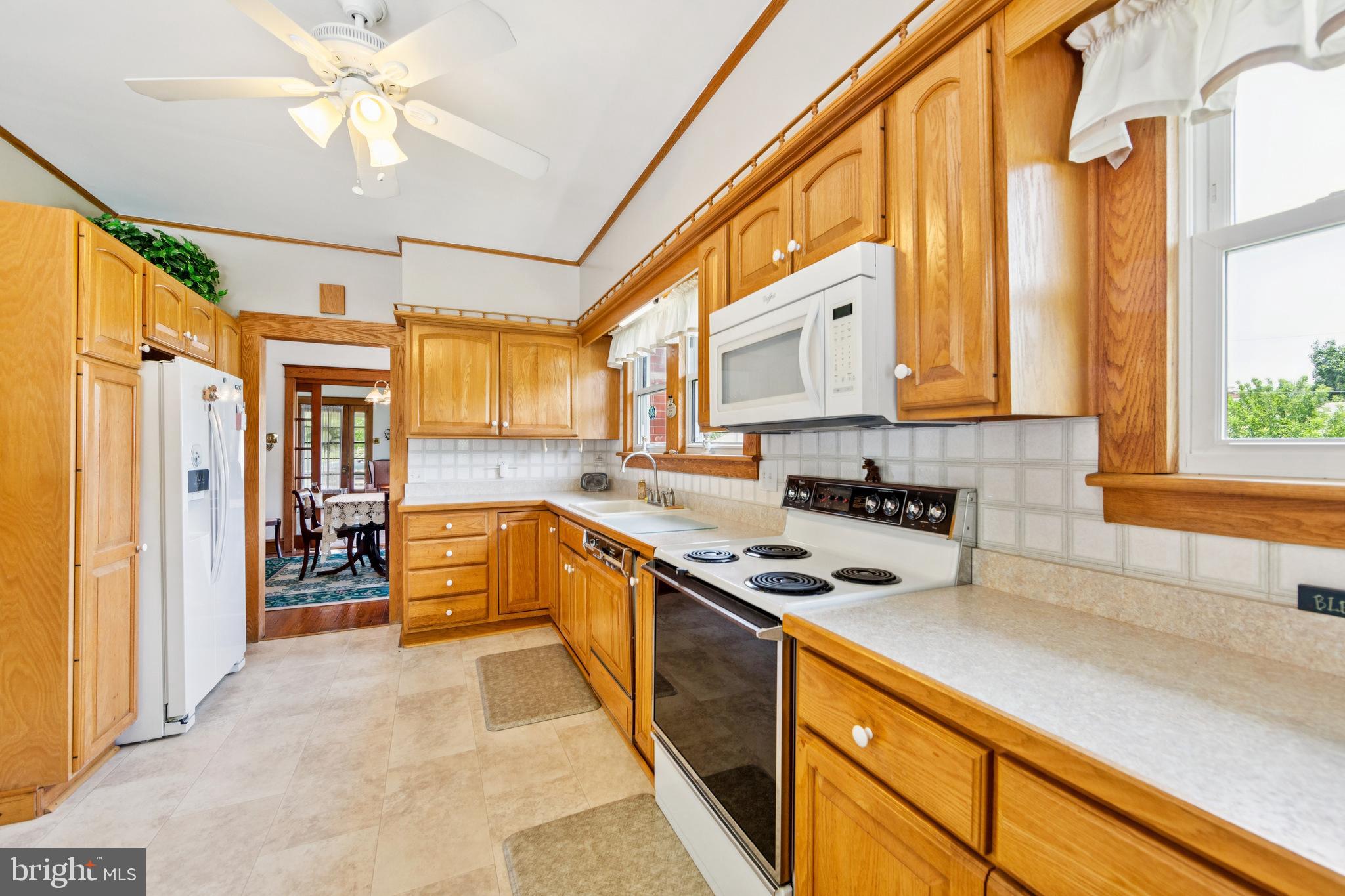 615 Convent Road Aston, PA 19014 - Photo 15 of 39 a kitchen with stainless steel appliances a stove a sink and cabinets