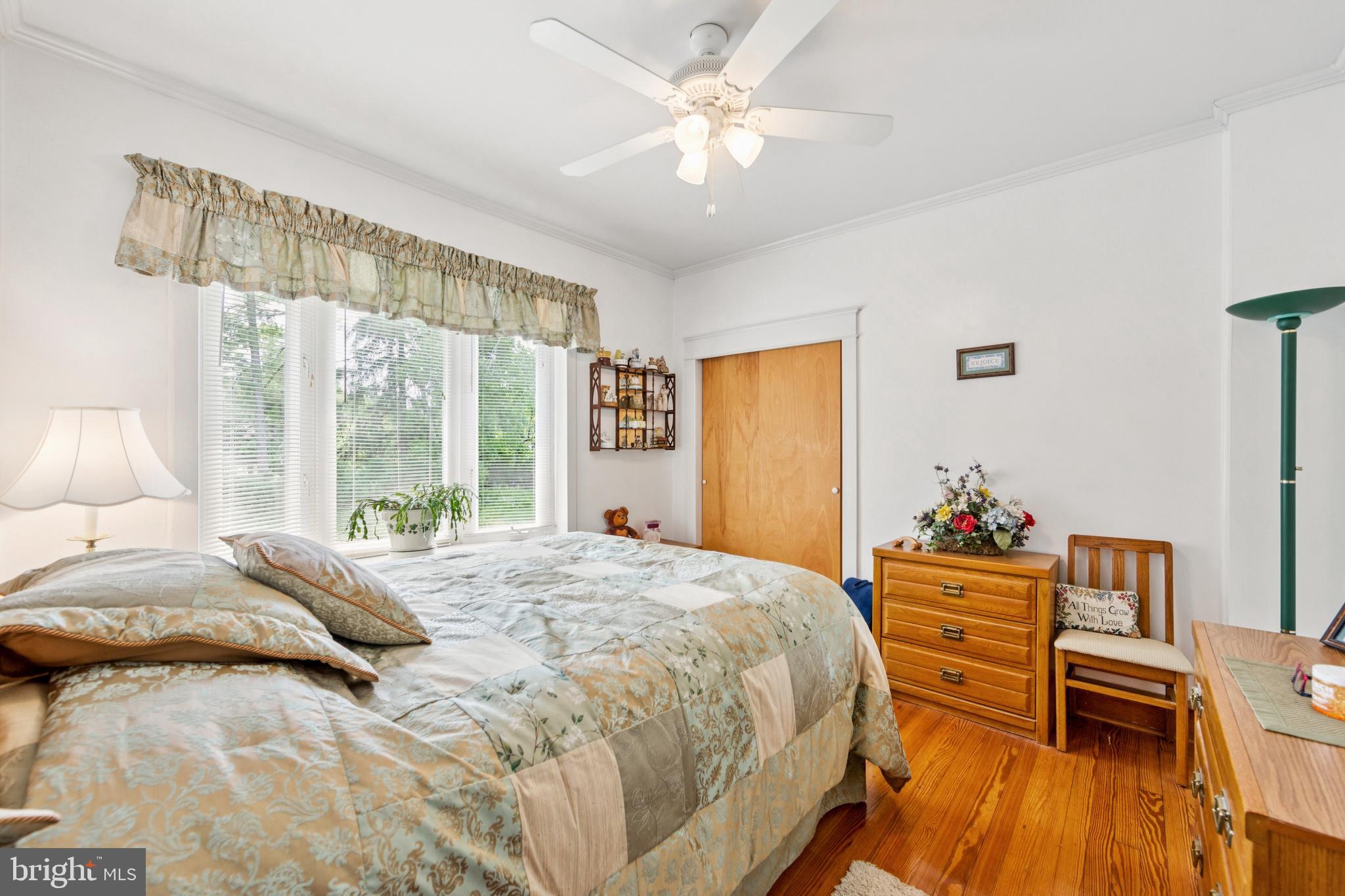 615 Convent Road Aston, PA 19014 - Photo 19 of 39 a bedroom with a bed and wooden floor