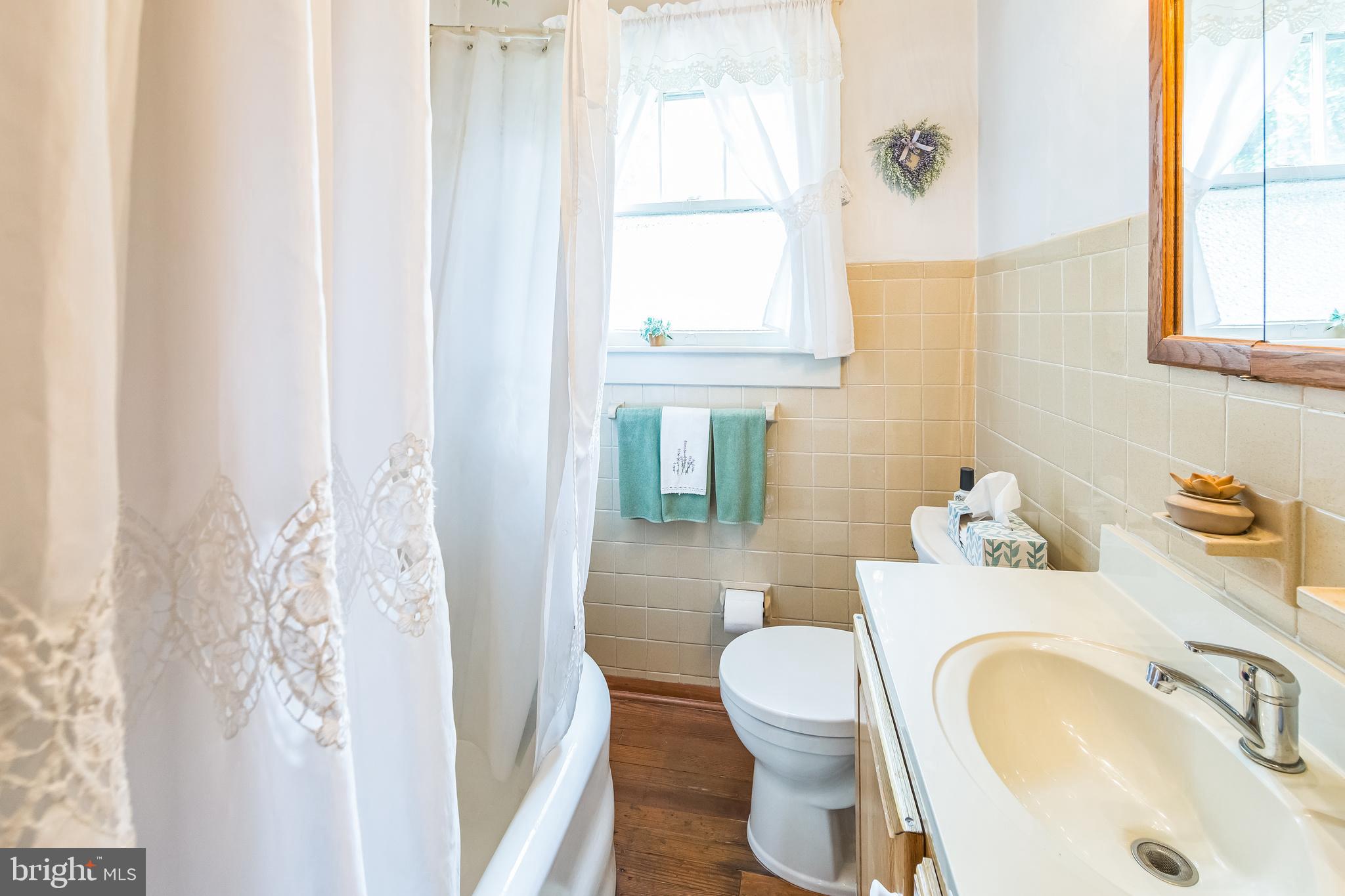 615 Convent Road Aston, PA 19014 - Photo 20 of 39 a bathroom with a sink toilet and mirror