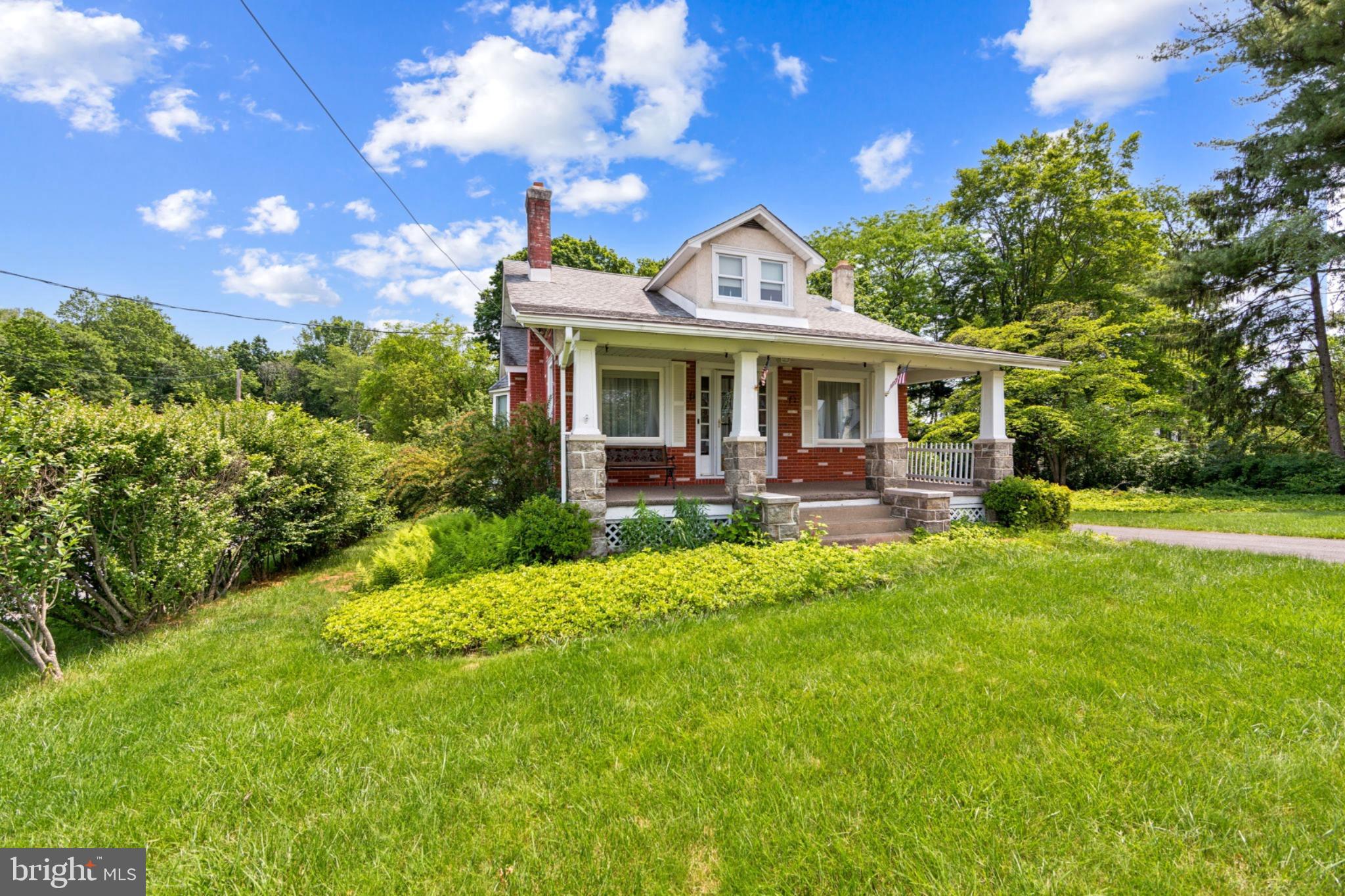 615 Convent Road Aston, PA 19014 - Photo 3 of 39 a front view of a house with a yard