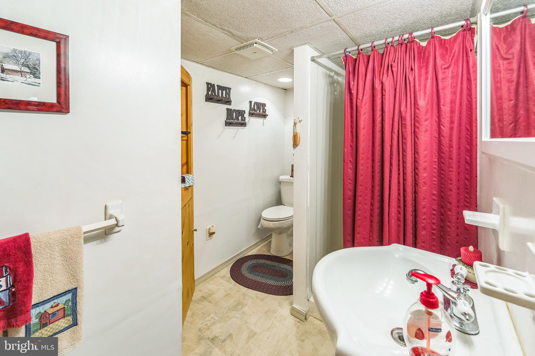 615 Convent Road Aston, PA 19014 - Photo 31 of 39 a bathroom with a sink toilet and shower
