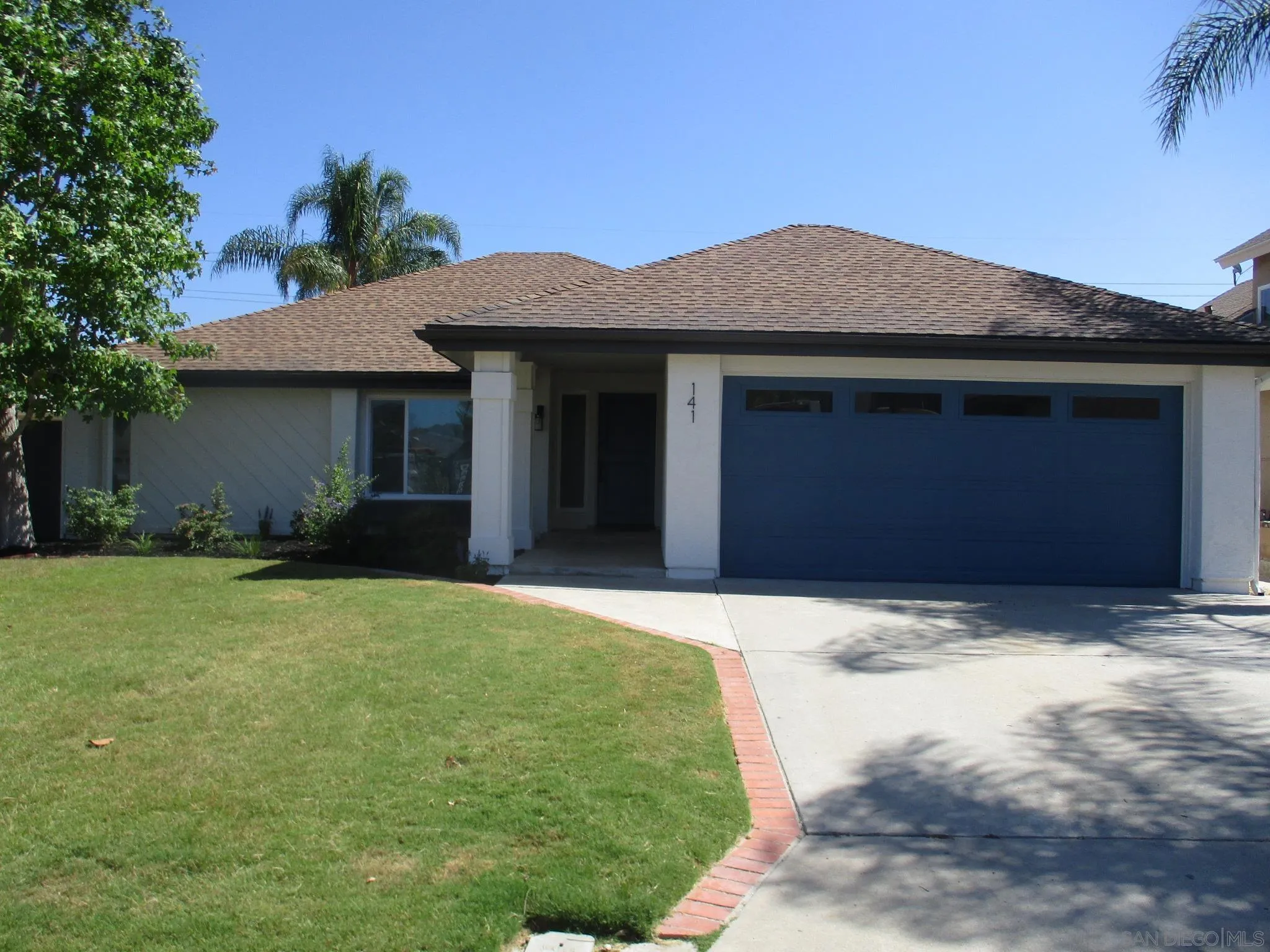 a house with yard in front of it