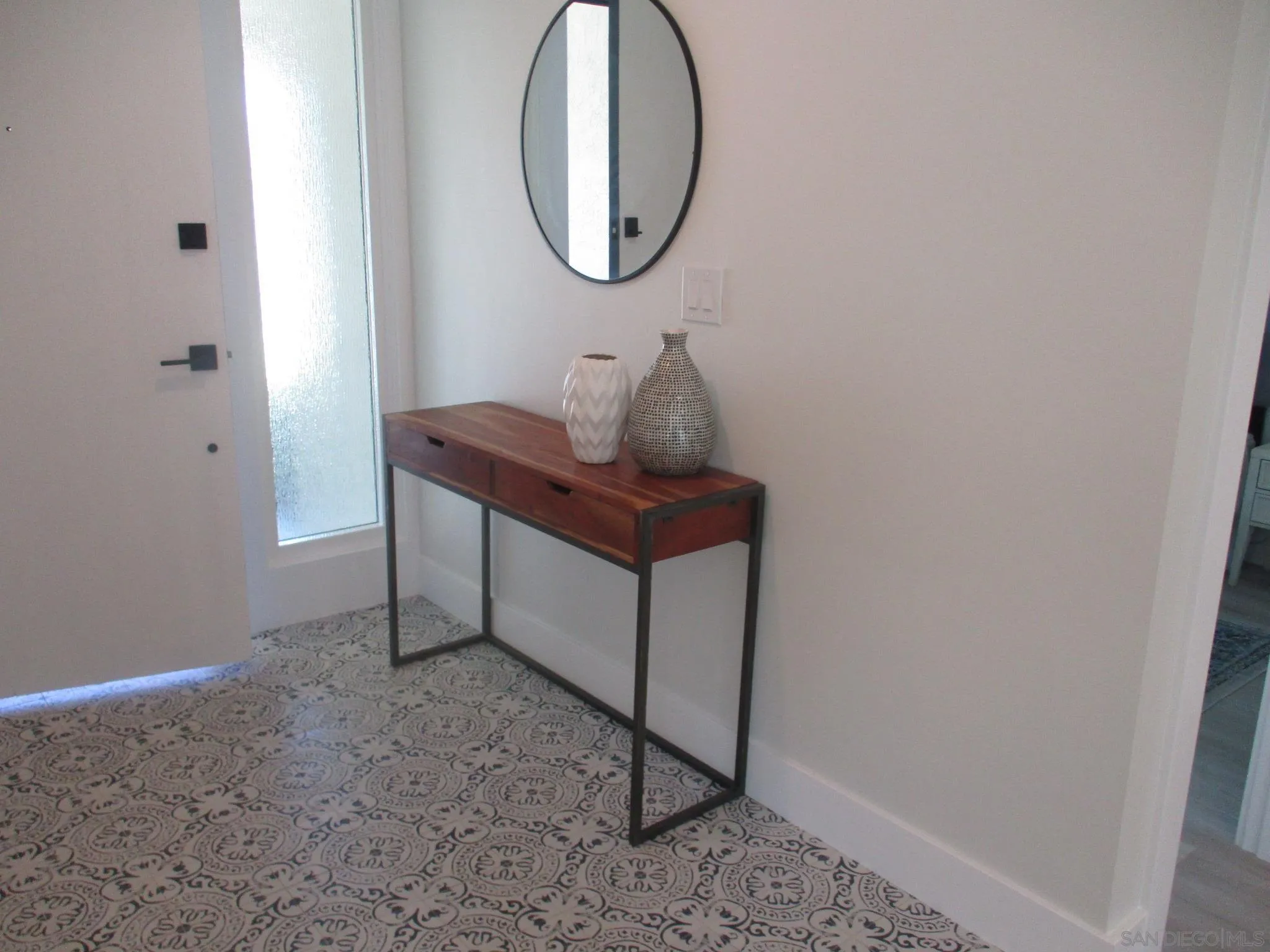 141 Solace Court Encinitas, CA 92024 - Photo 12 of 16 a room with a table and a mirror