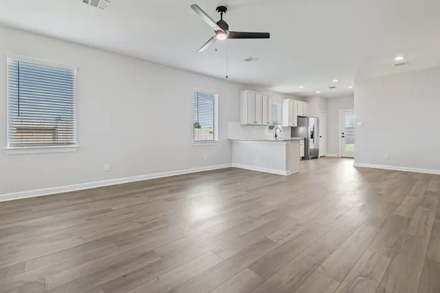 a view of kitchen with wooden floor