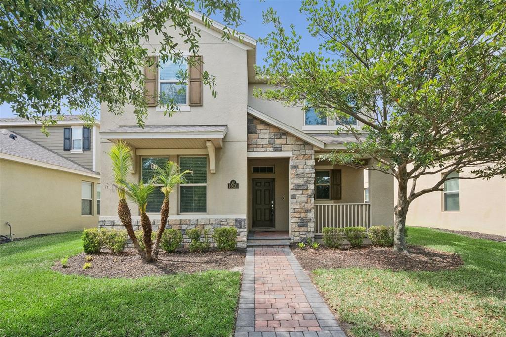 16031 Pebble Blf Loop Winter Garden, FL 34787 - Photo 1 of 51 front view of a house with a small yard