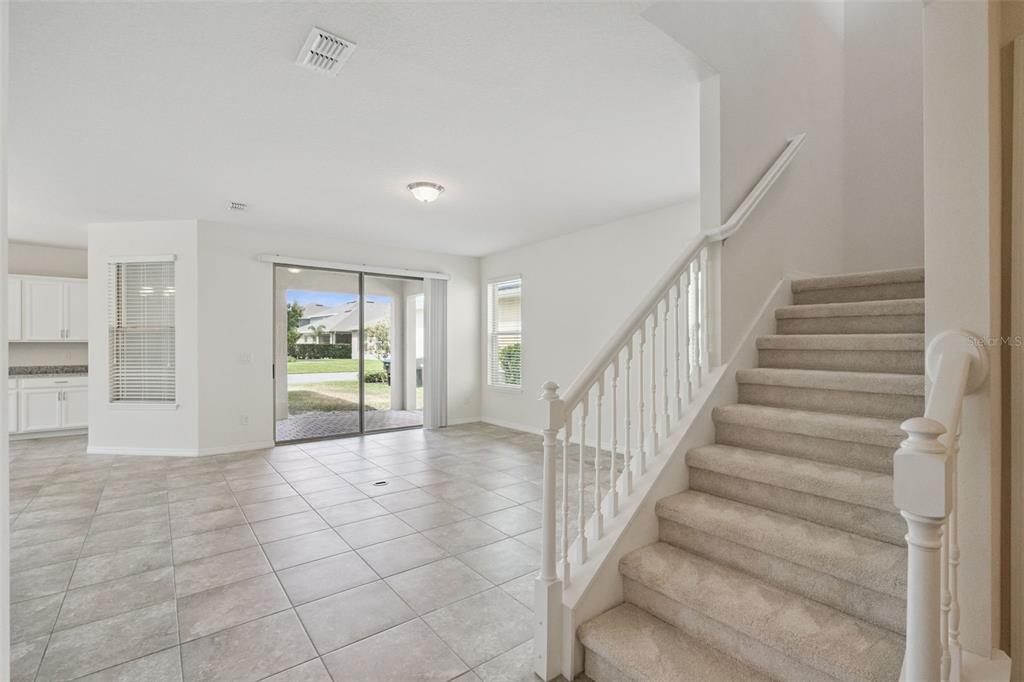 16031 Pebble Blf Loop Winter Garden, FL 34787 - Photo 12 of 51 a view of entryway and hall with a living room