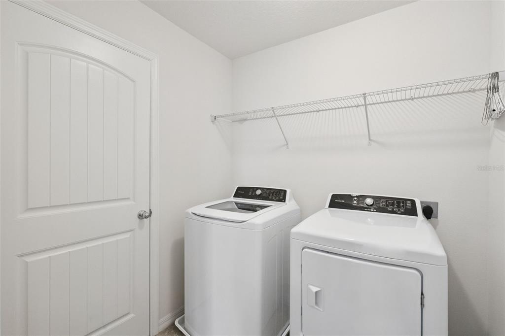 16031 Pebble Blf Loop Winter Garden, FL 34787 - Photo 15 of 51 a utility room with dryer and washer