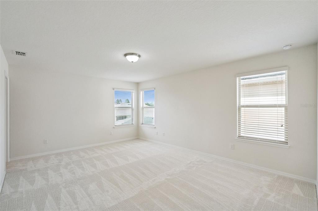16031 Pebble Blf Loop Winter Garden, FL 34787 - Photo 17 of 51 a view of an empty room with a window