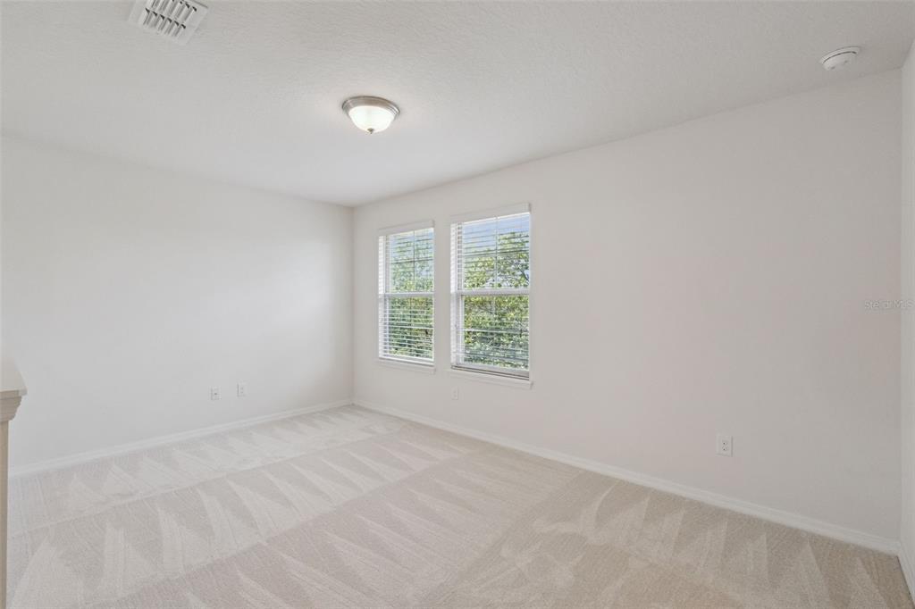 16031 Pebble Blf Loop Winter Garden, FL 34787 - Photo 20 of 51 an empty room with a window