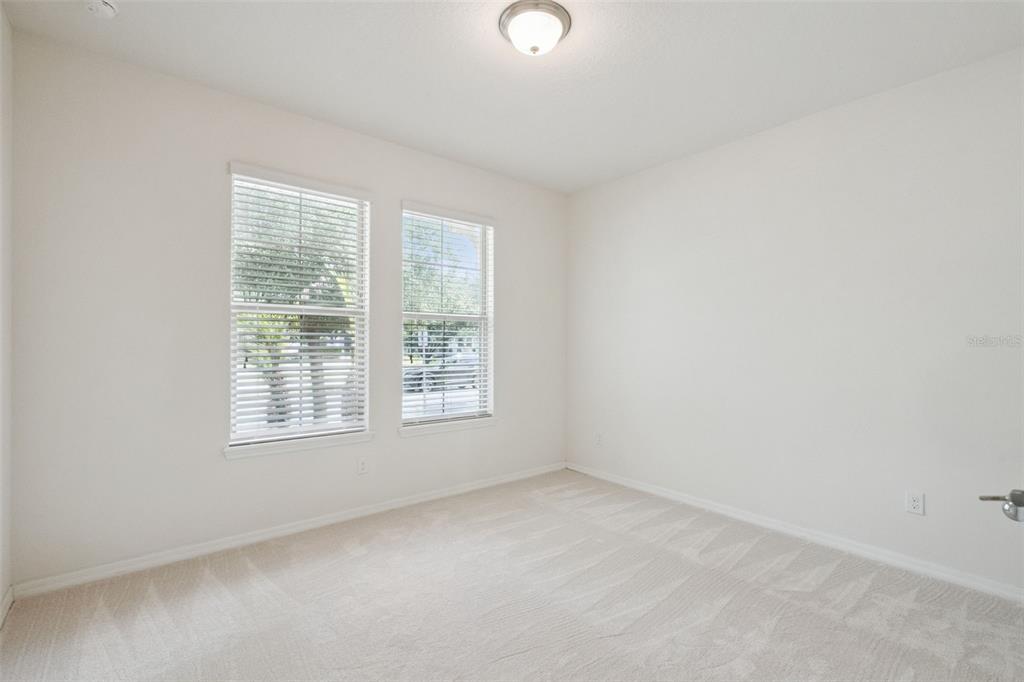 16031 Pebble Blf Loop Winter Garden, FL 34787 - Photo 21 of 51 an empty room with a window