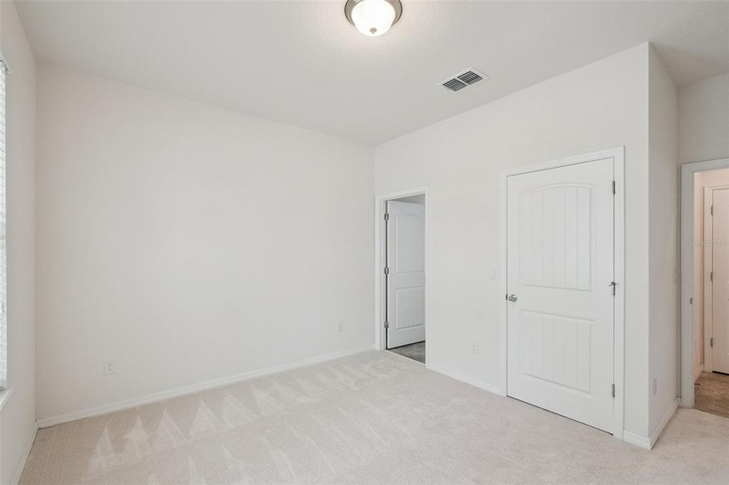 16031 Pebble Blf Loop Winter Garden, FL 34787 - Photo 22 of 51 a view of an empty room