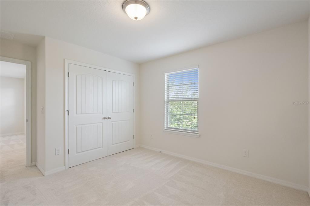 16031 Pebble Blf Loop Winter Garden, FL 34787 - Photo 24 of 51 an empty room with windows