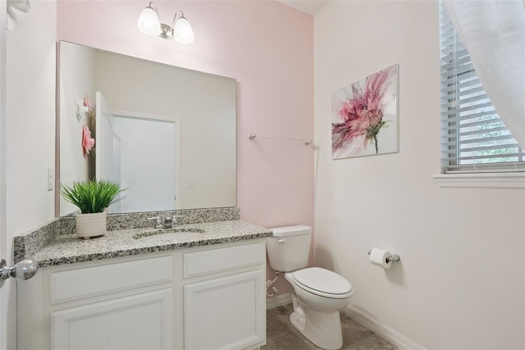 16031 Pebble Blf Loop Winter Garden, FL 34787 - Photo 27 of 51 a bathroom with a granite countertop toilet and a sink