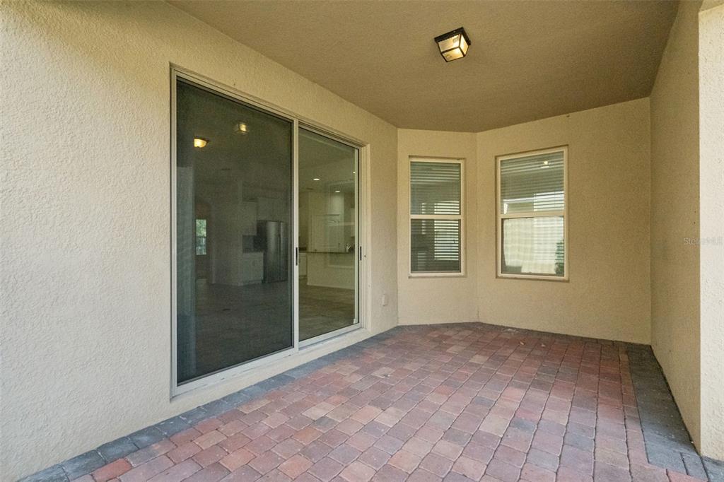 16031 Pebble Blf Loop Winter Garden, FL 34787 - Photo 28 of 51 a view of an empty room with glass door