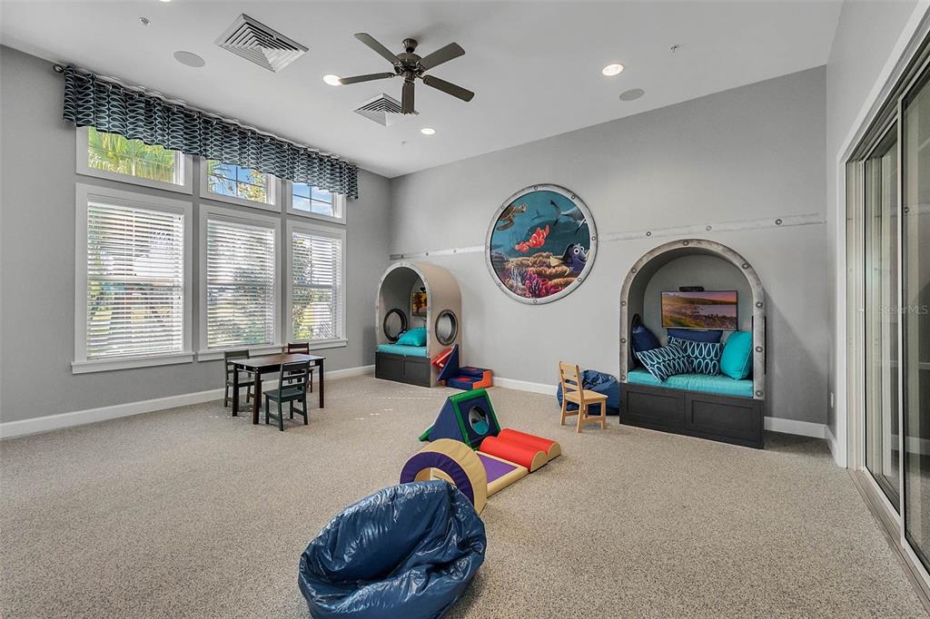 16031 Pebble Blf Loop Winter Garden, FL 34787 - Photo 40 of 51 a living room with furniture a rug and a large window