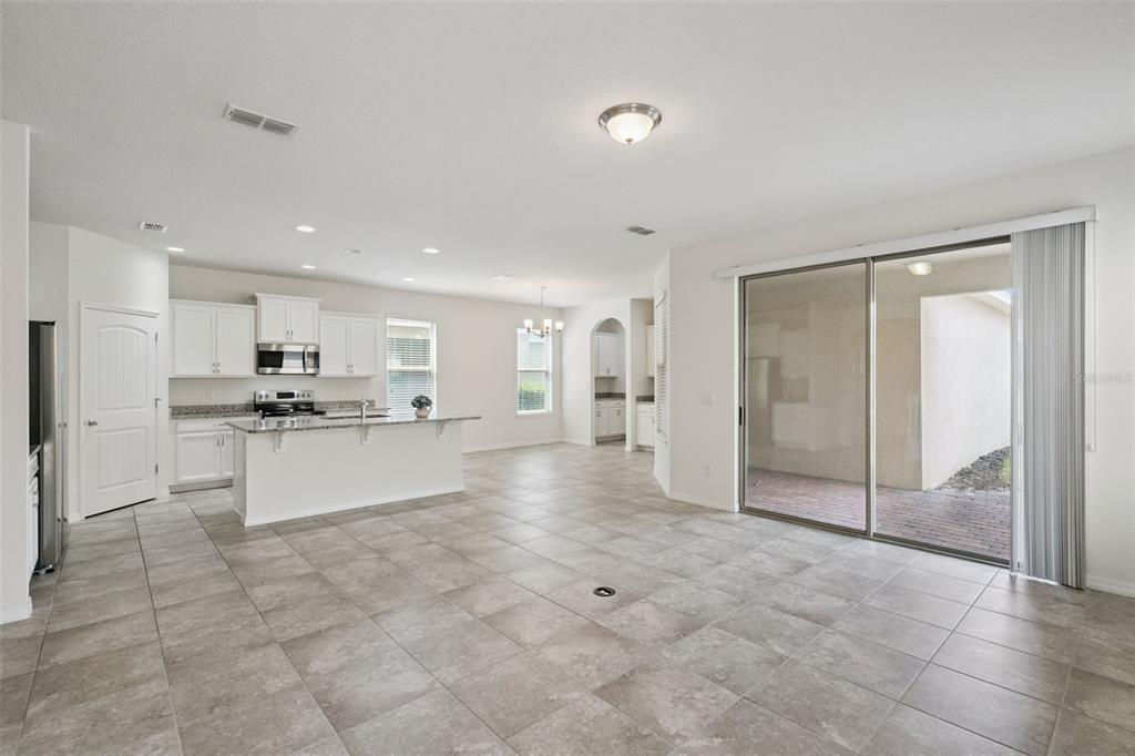 16031 Pebble Blf Loop Winter Garden, FL 34787 - Photo 5 of 51 a view of kitchen with granite countertop a counter top space cabinets and stainless steel appliances