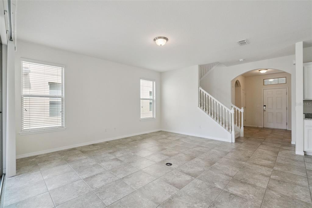 16031 Pebble Blf Loop Winter Garden, FL 34787 - Photo 6 of 51 a view of an empty room with a window