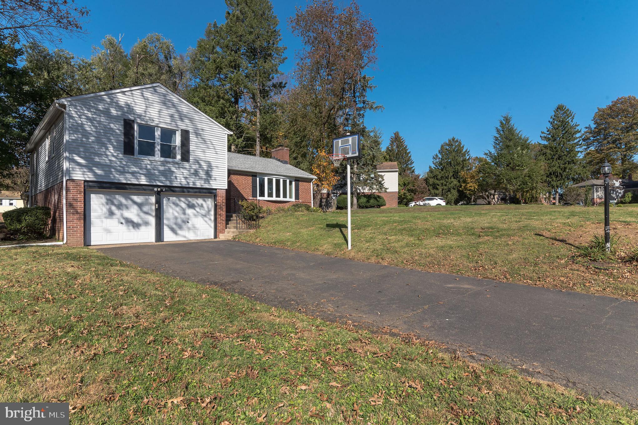 1376 Michael Road Jenkintown, PA 19046 - Photo 2 of 30 a front view of a house with a yard and garage
