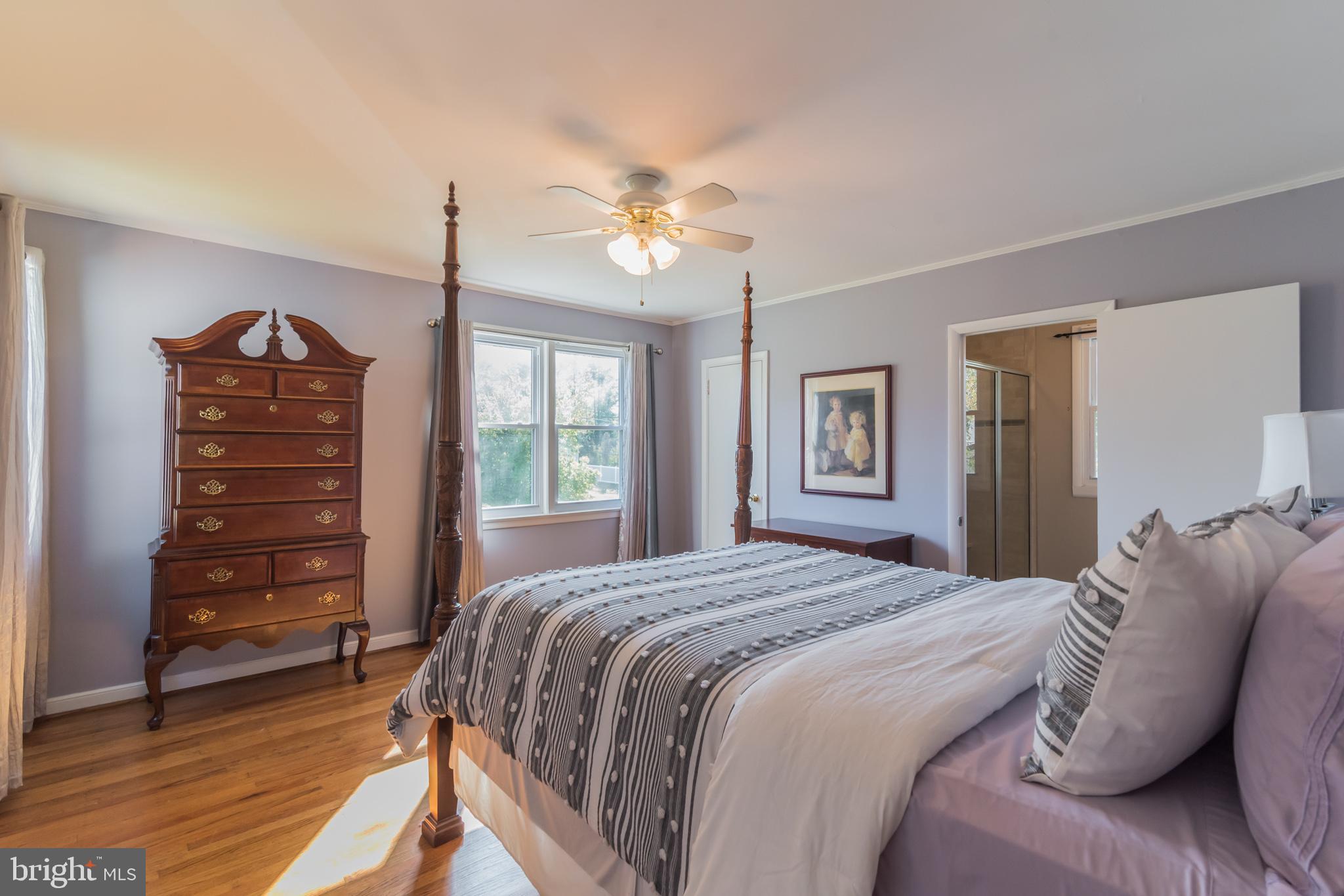 1376 Michael Road Jenkintown, PA 19046 - Photo 12 of 30 a bedroom with a bed a dresser and a chandelier