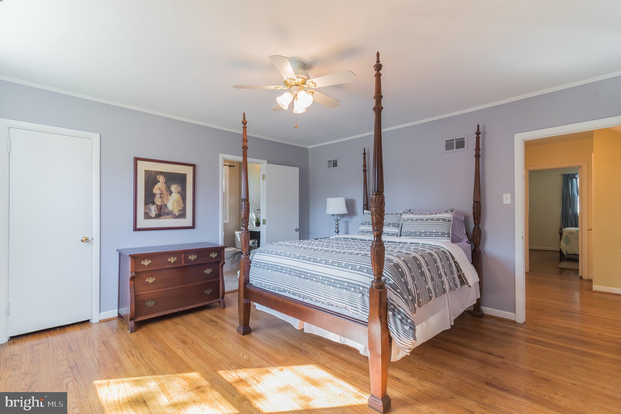 1376 Michael Road Jenkintown, PA 19046 - Photo 13 of 30 a spacious bedroom with a bed and a chandelier