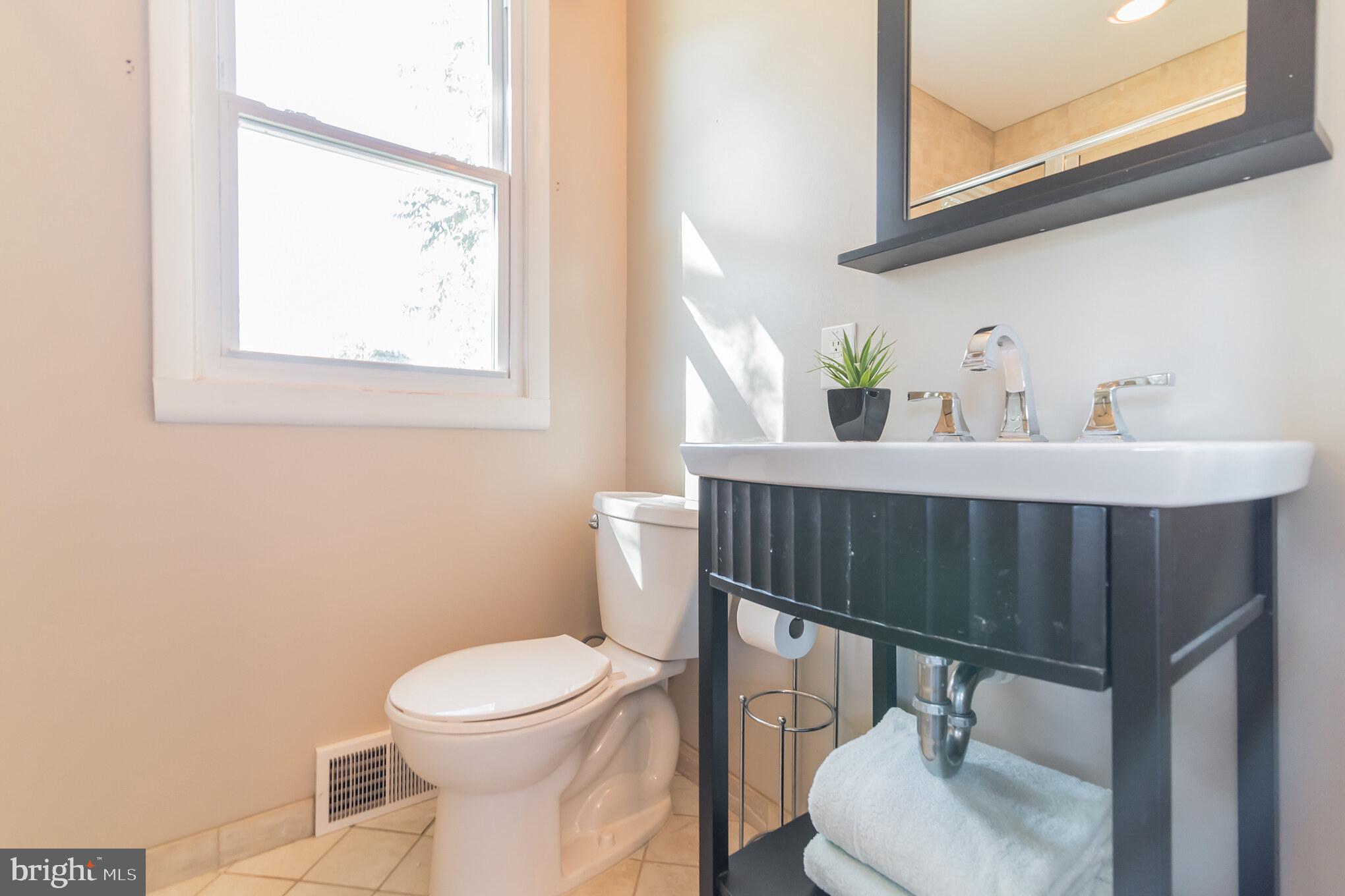 1376 Michael Road Jenkintown, PA 19046 - Photo 14 of 30 a bathroom with a sink a toilet and a mirror