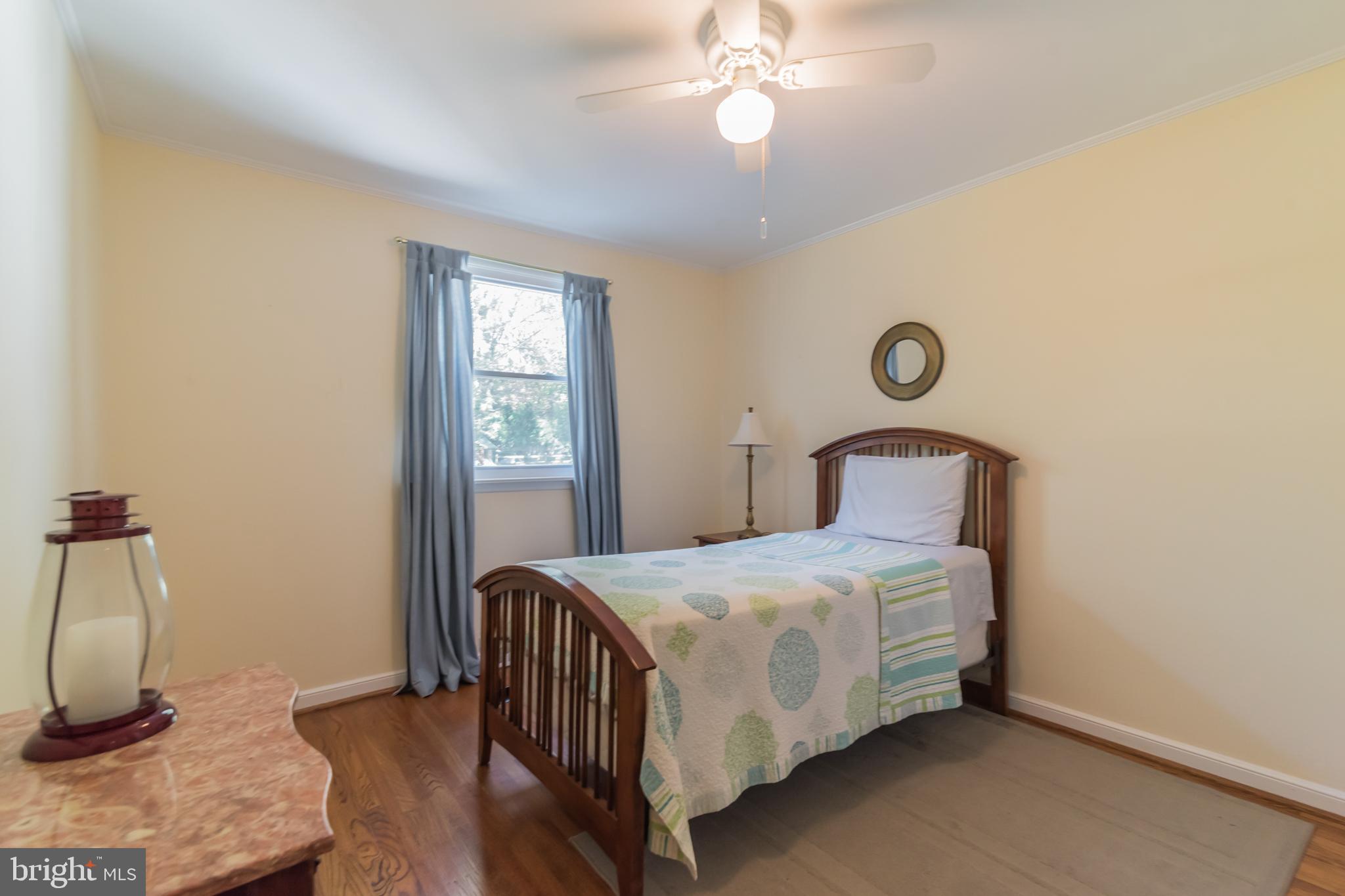 1376 Michael Road Jenkintown, PA 19046 - Photo 16 of 30 a bedroom with a bed and wooden floor