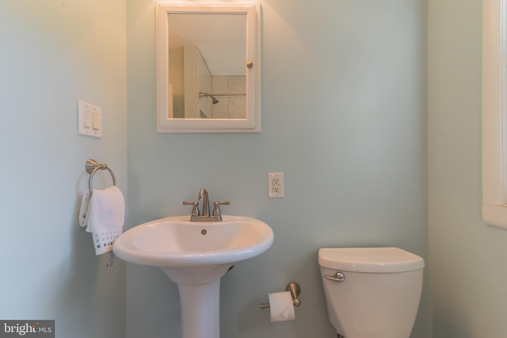 1376 Michael Road Jenkintown, PA 19046 - Photo 18 of 30 a bathroom with a toilet sink and mirror