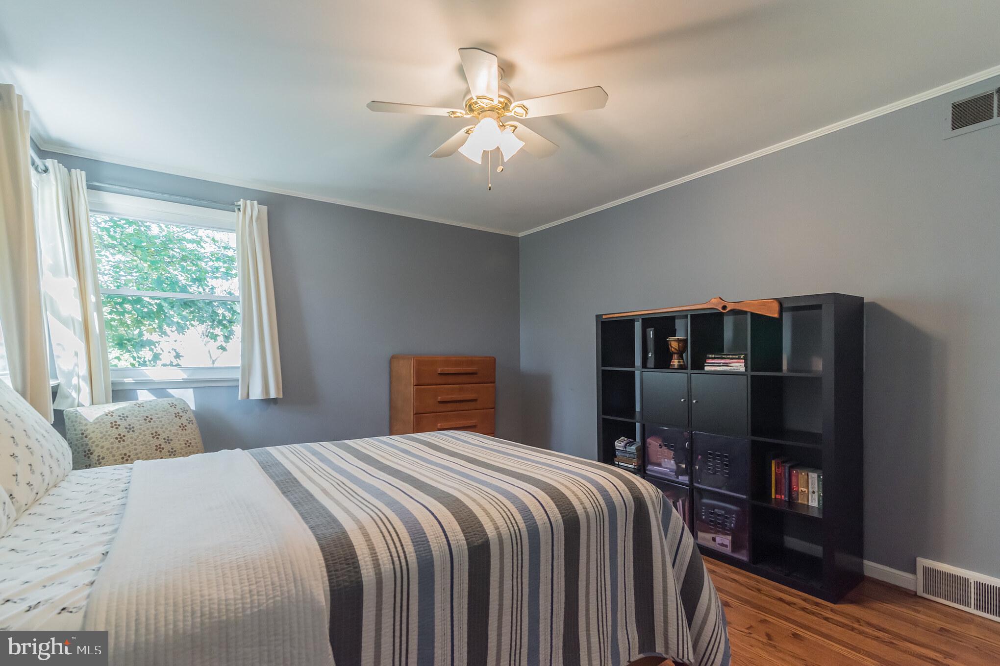 1376 Michael Road Jenkintown, PA 19046 - Photo 21 of 30 a bedroom with a large bed and a chandelier
