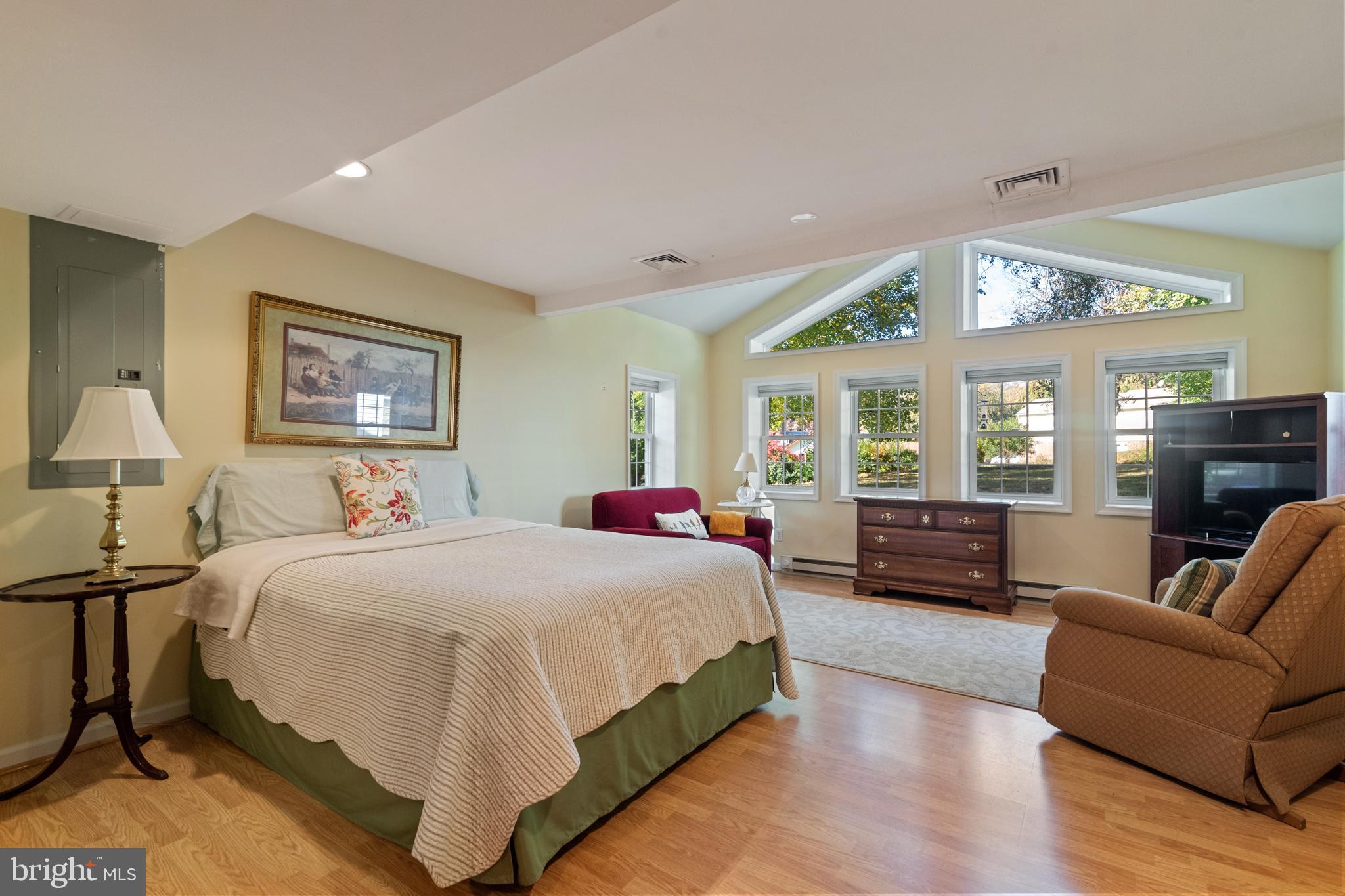 1376 Michael Road Jenkintown, PA 19046 - Photo 24 of 30 a spacious bedroom with a large bed couch and a window