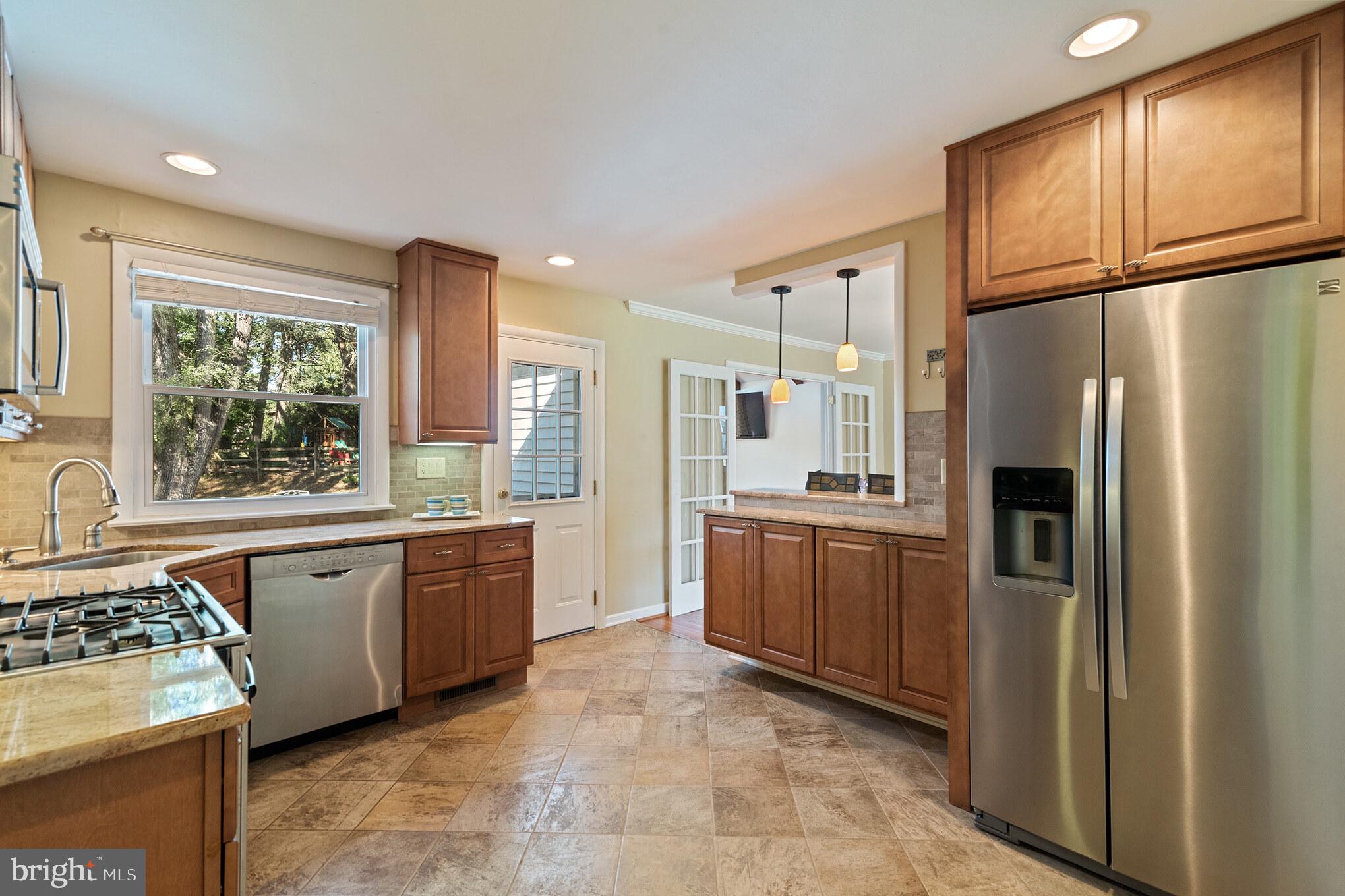 1376 Michael Road Jenkintown, PA 19046 - Photo 7 of 30 a kitchen with stainless steel appliances granite countertop a refrigerator stove sink and window
