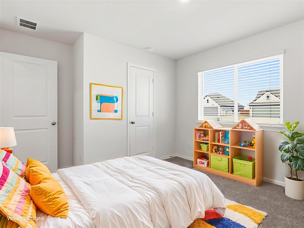 757 Tiger Lily Way Pilot Point, TX 76258 - Photo 14 of 16 a bedroom with a bed and a window