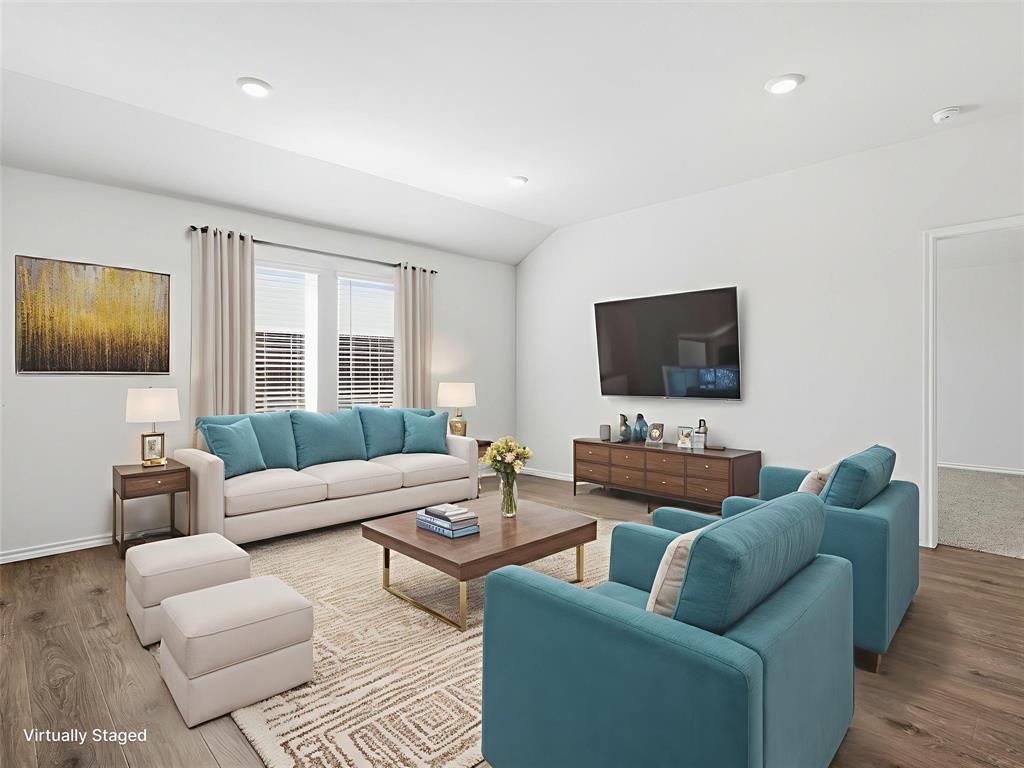 757 Tiger Lily Way Pilot Point, TX 76258 - Photo 2 of 16 a living room with furniture and a flat screen tv