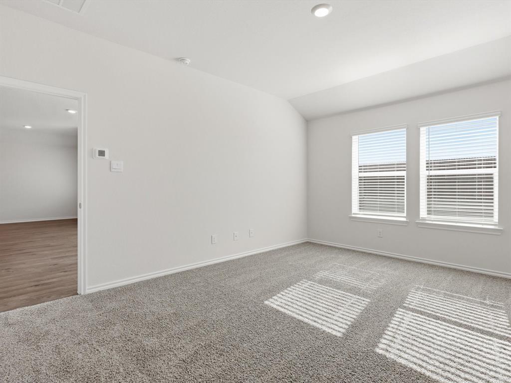757 Tiger Lily Way Pilot Point, TX 76258 - Photo 8 of 16 a view of an empty room with a window