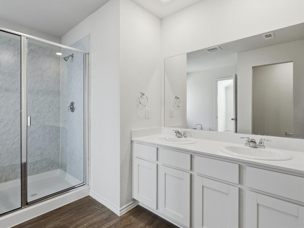 757 Tiger Lily Way Pilot Point, TX 76258 - Photo 9 of 16 a bathroom with a shower sink and mirror