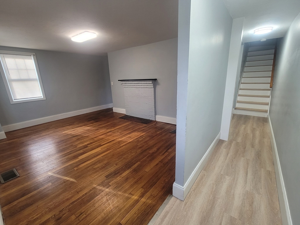 237 Colburn Street, Unit 237 Dedham, MA 02026 - Photo 5 of 16 a view of empty room with wooden floor