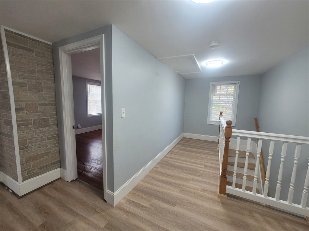 237 Colburn Street, Unit 237 Dedham, MA 02026 - Photo 9 of 16 a view of hallway with wooden floor
